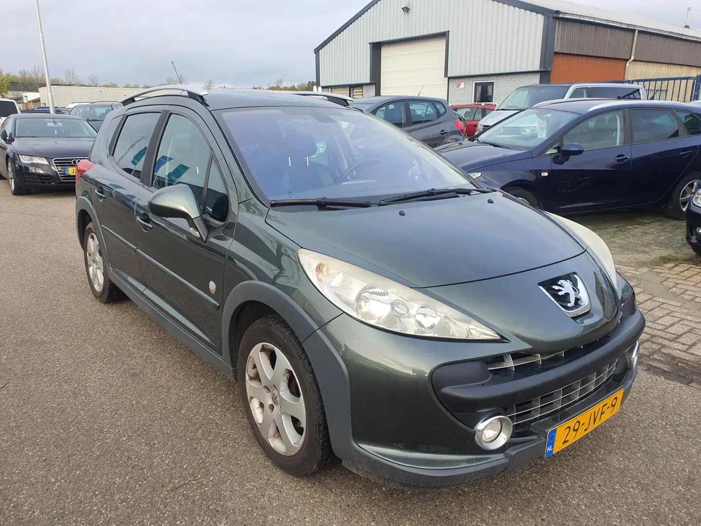 Peugeot 207 SW Outdoor 1.6 VTi Sublime Clima Bj.:2009 NAP! Grijs - 2