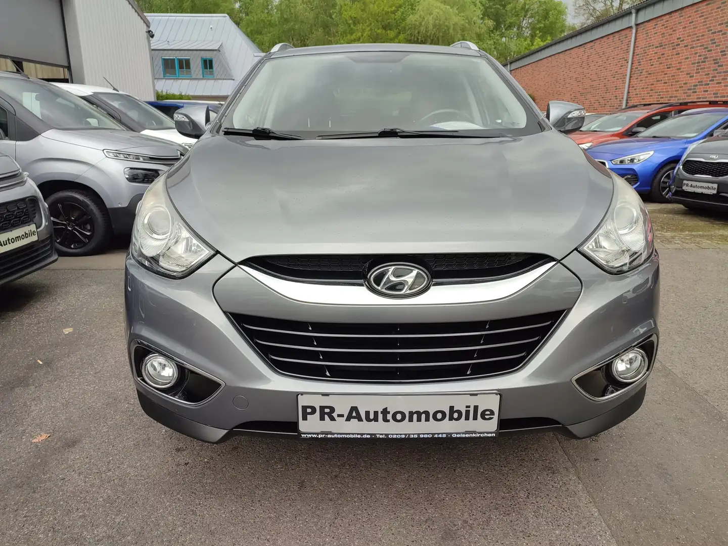 Hyundai iX35 1.6 2WD Klimaaut/Navi/Alu/PDC+Cam/Allwetter Grau - 2