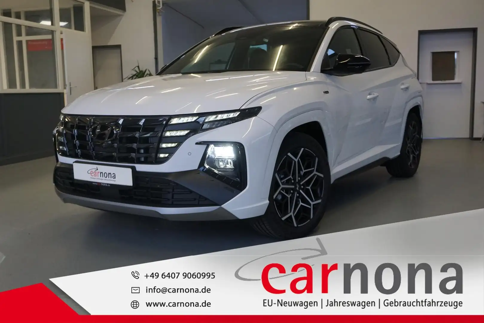 Hyundai TUCSON N-Line  4WD 180 PS DCT MHEV/19"/P-Dach/Krell Weiß - 1
