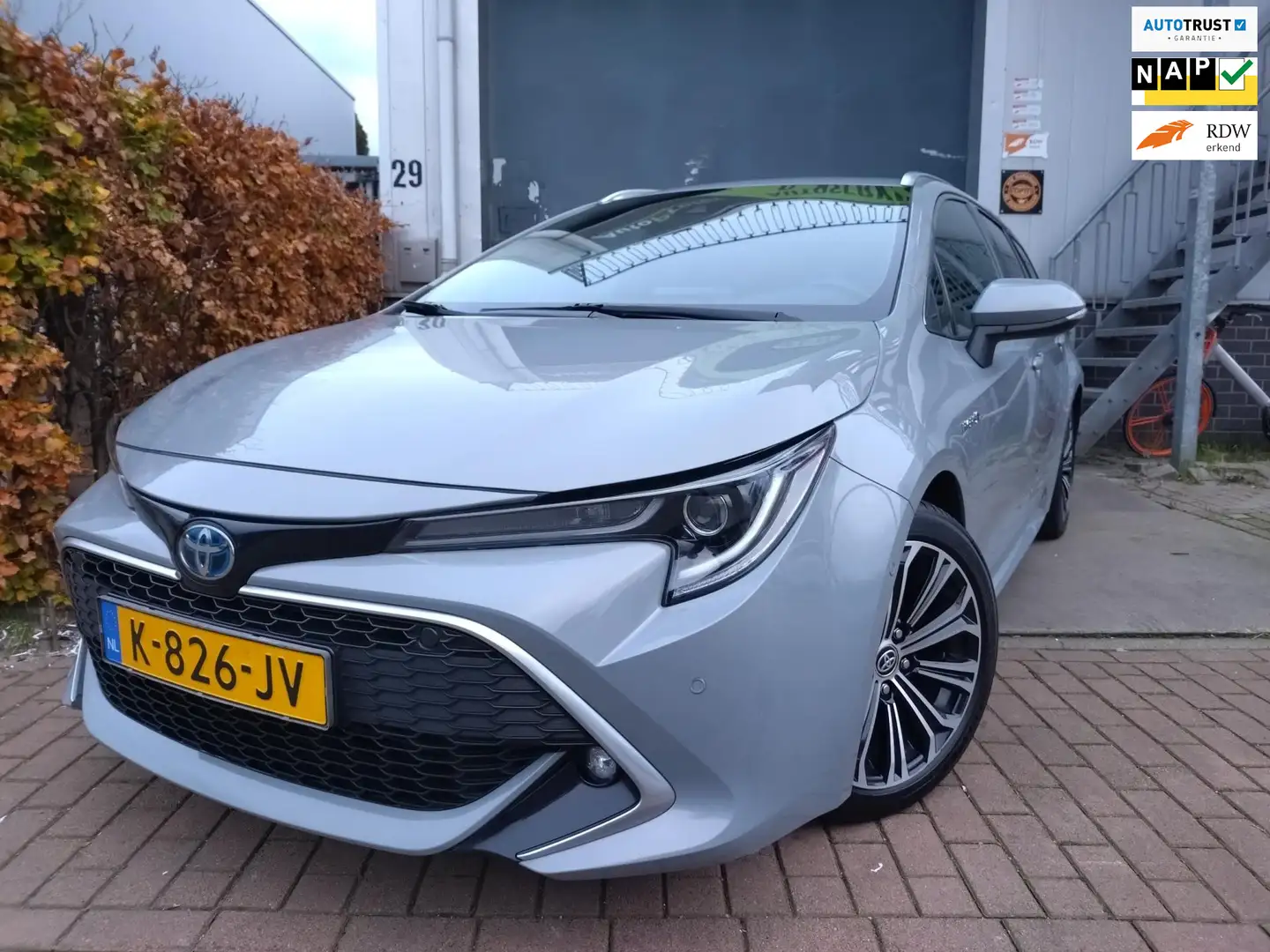 Toyota Corolla Touring Sports 1.8 Hybrid Executive HUD Grijs - 1