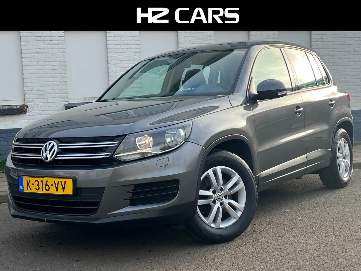 Volkswagen Tiguan 1.4 TSI Sport&Style|Trekhaak|PDC|Navi|Clima|Cruise Grijs - 1