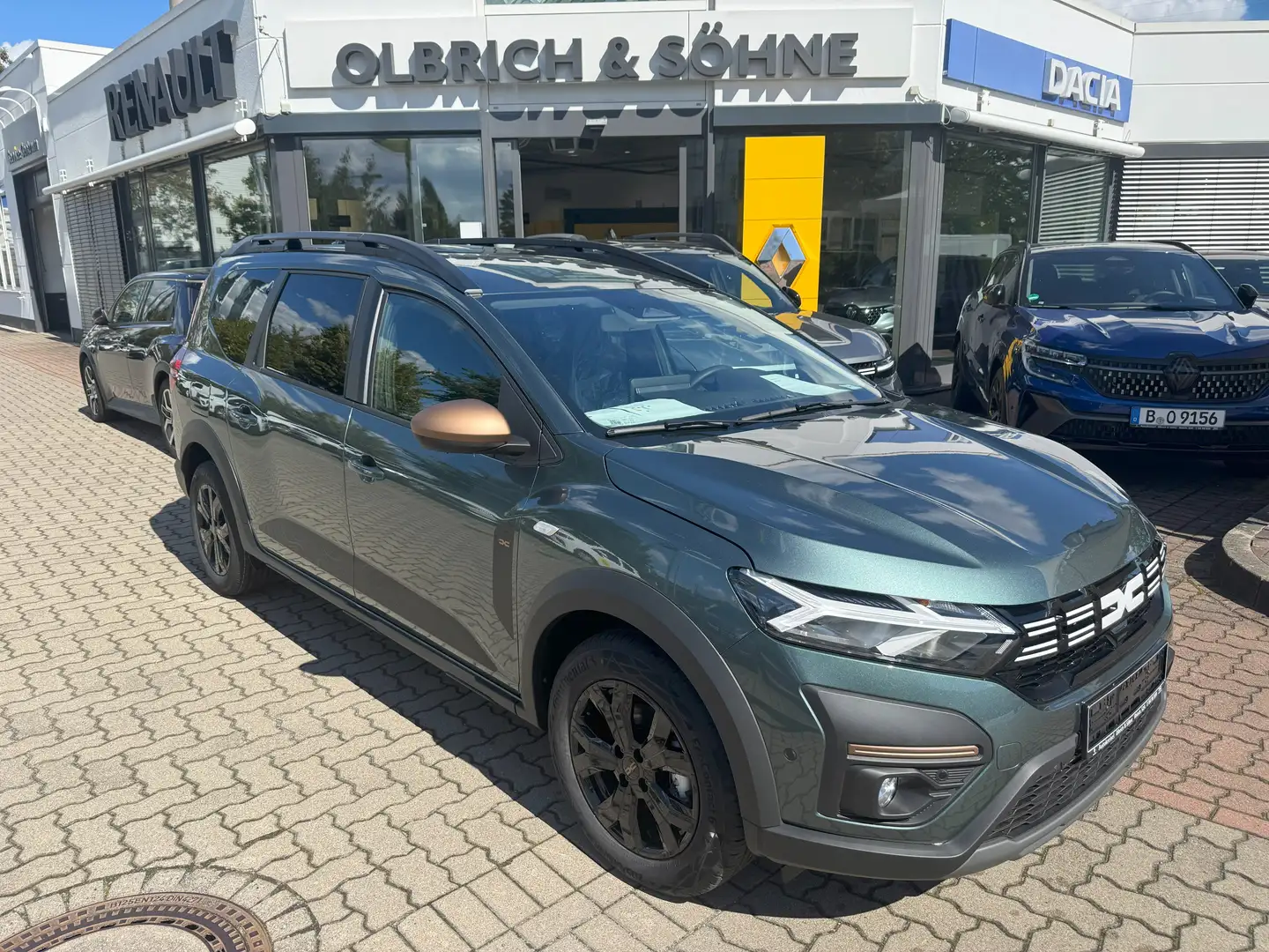 Dacia Jogger Extreme HYBRID 140 7-Sitzer CityP Navi SitzH Grün - 1