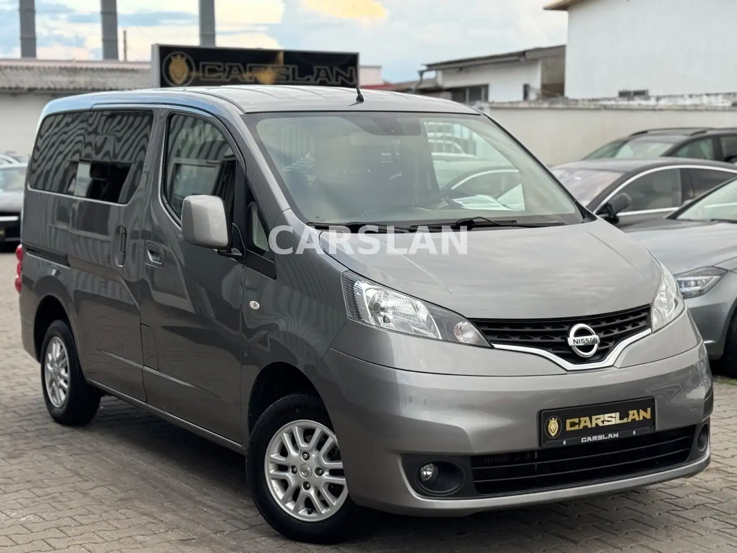 Nissan NV200 Evalia Tekna 2.HND+7-SITZER+R.KAM+NAVI+AHK Grau - 1