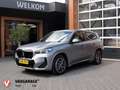 BMW iX1 eDrive20 67 kWh | M-Pakket | NL-Auto | Innovation Gris - thumbnail 1