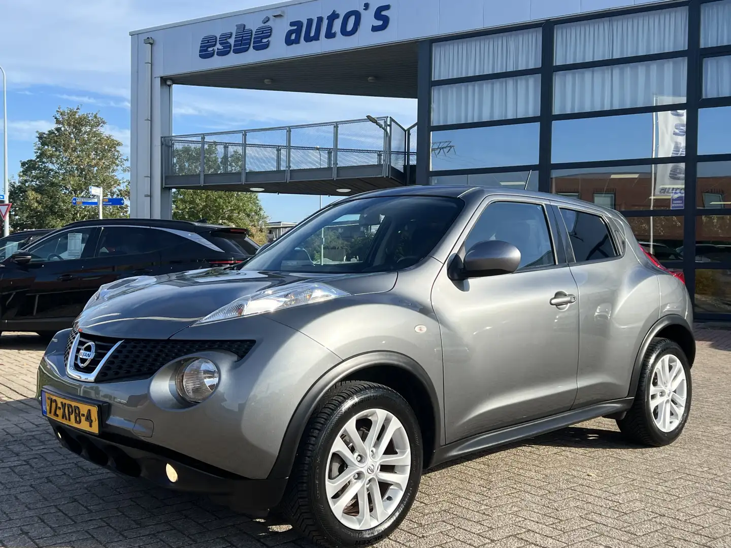 Nissan Juke 1.6 Acenta Clima + Cruise Control 17 Inch Velgen E Grau - 1