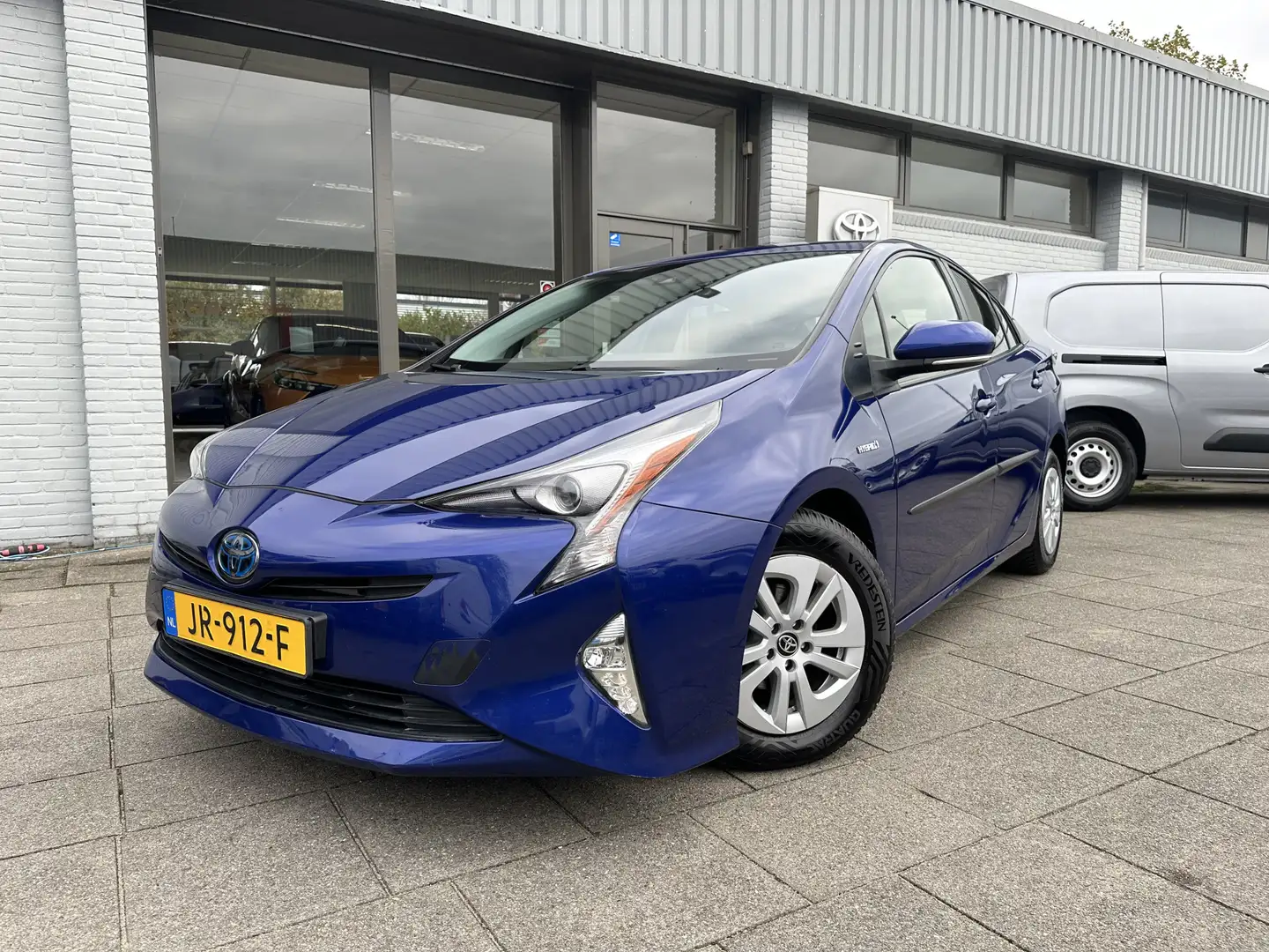 Toyota Prius 1.8 Hybrid Aspiration Automaat | Trekhaak | Cruise Blauw - 1