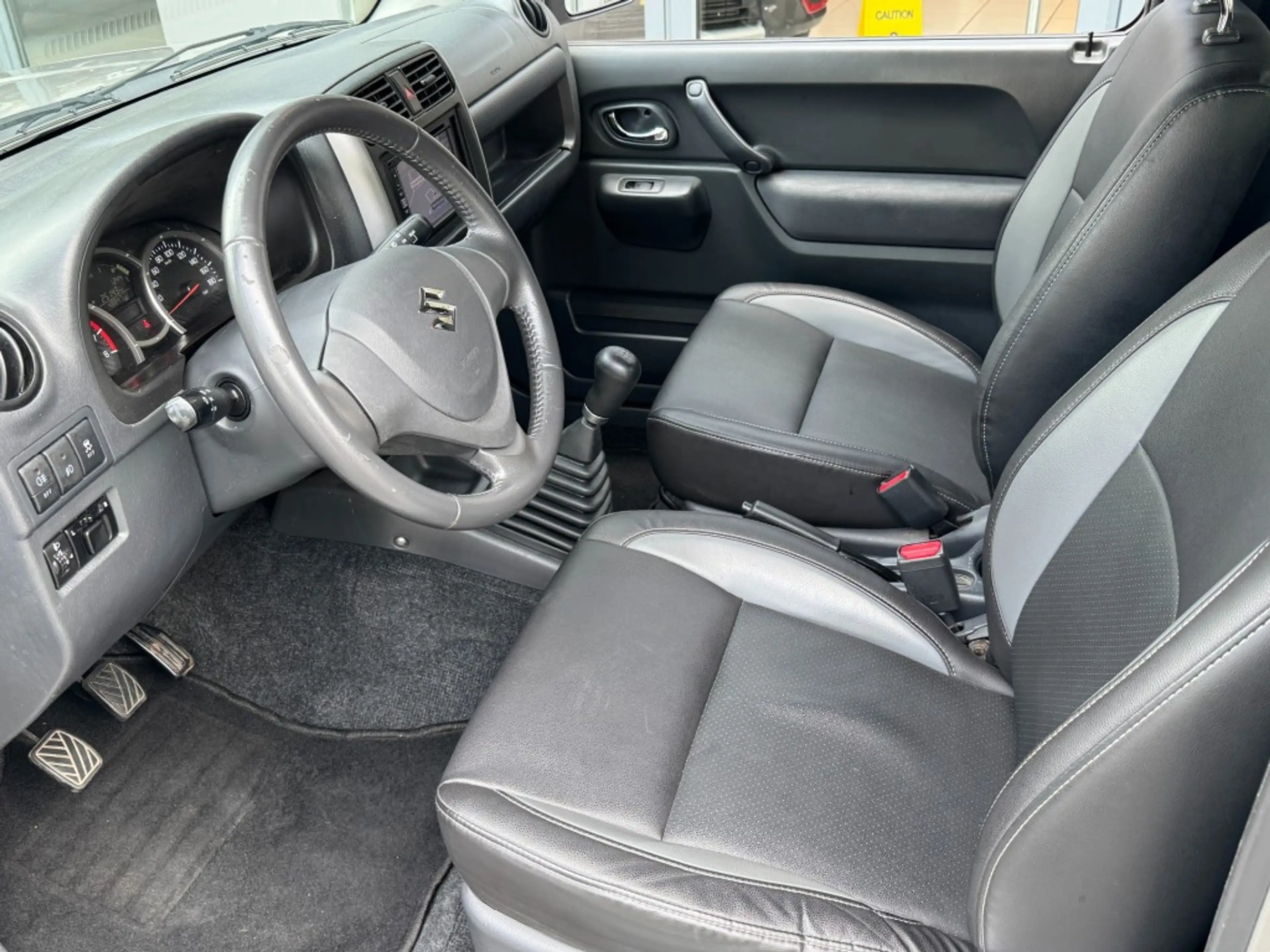 Suzuki Jimny 1.3 Exclusive 4x4 Airco/Leder/Trekhaak/Camera acht — photo 21