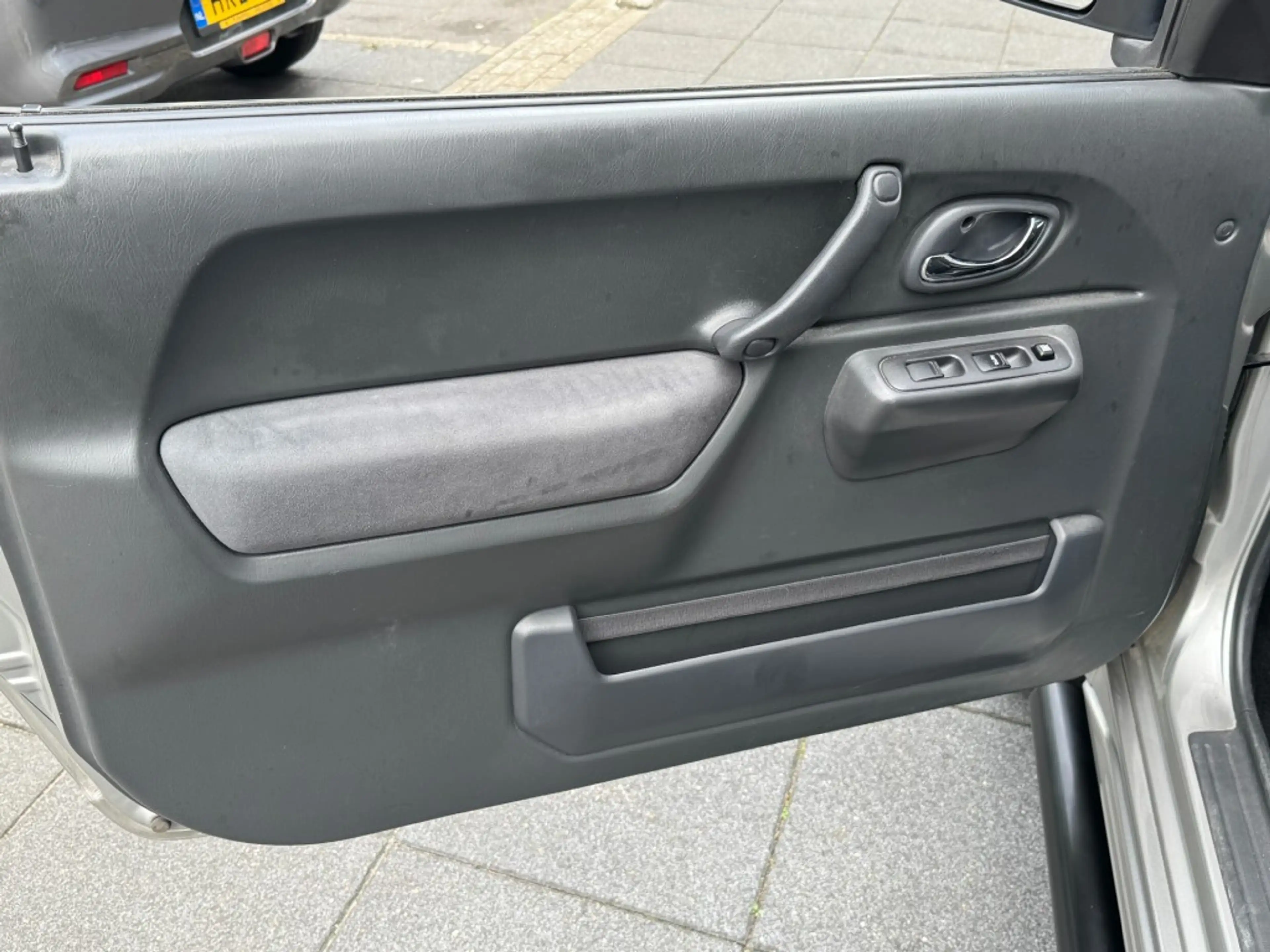 Suzuki Jimny 1.3 Exclusive 4x4 Airco/Leder/Trekhaak/Camera acht — photo 19