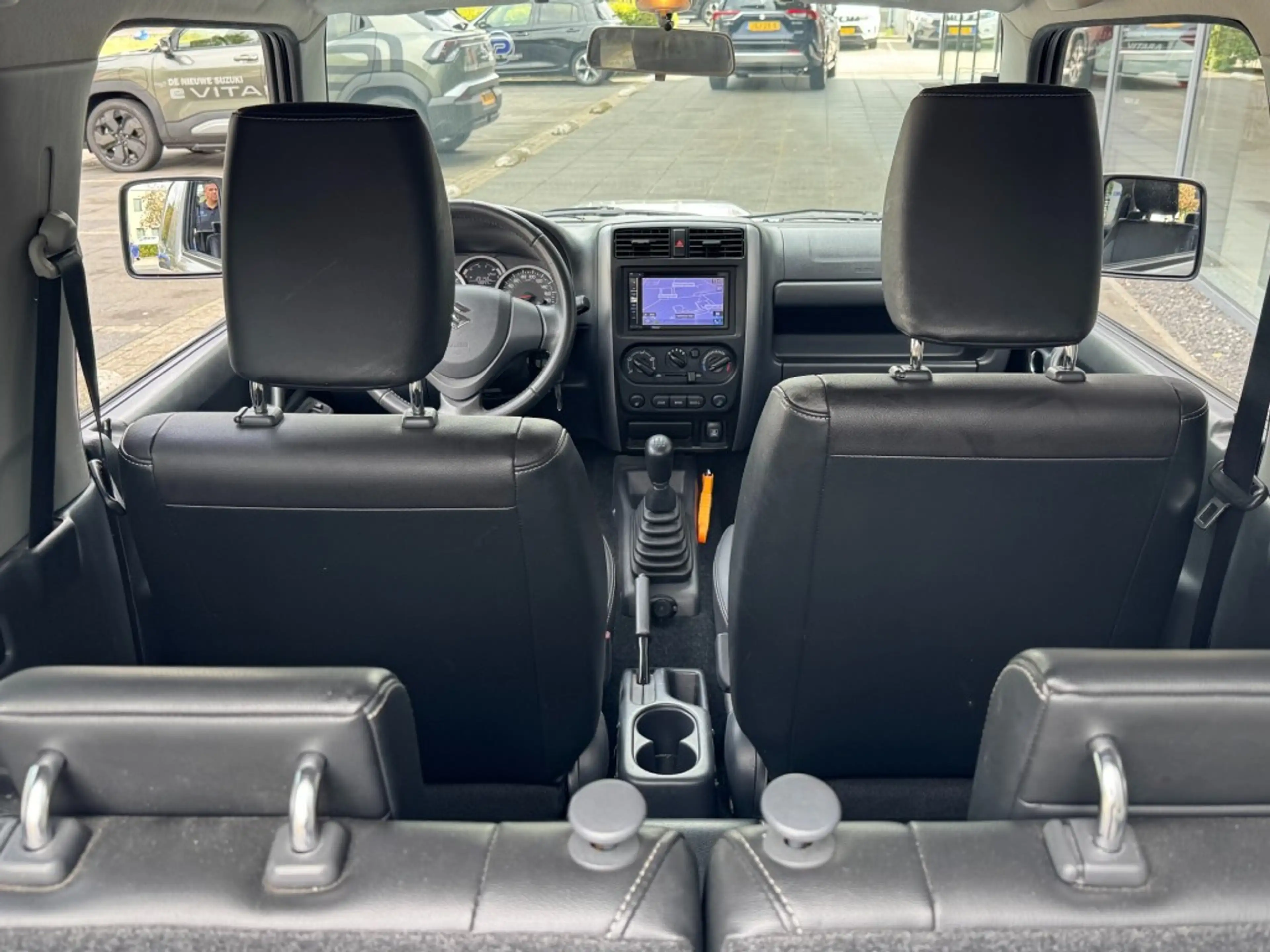 Suzuki Jimny 1.3 Exclusive 4x4 Airco/Leder/Trekhaak/Camera acht — photo 24