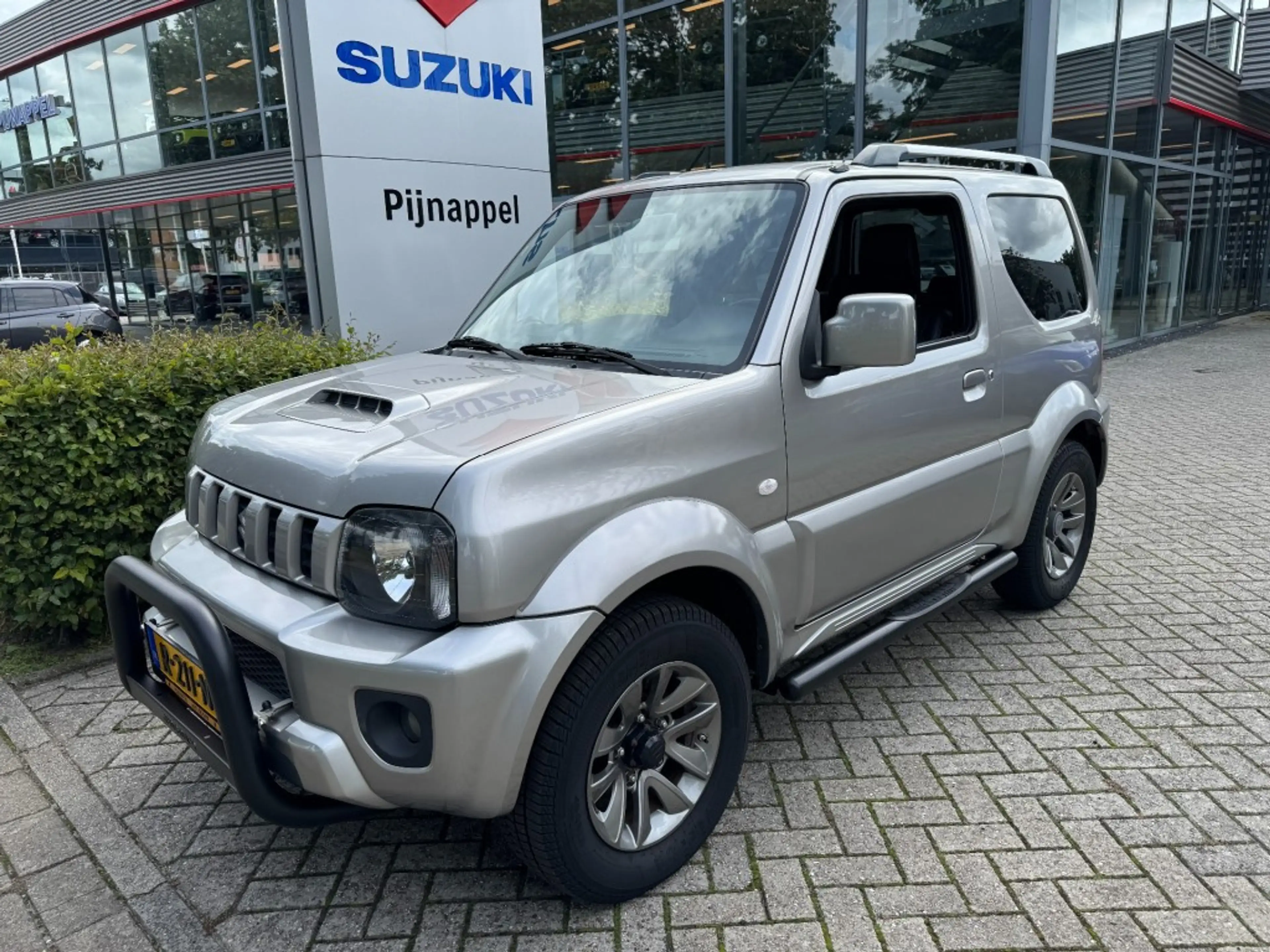 Suzuki Jimny 1.3 Exclusive 4x4 Airco/Leder/Trekhaak/Camera acht — photo 7