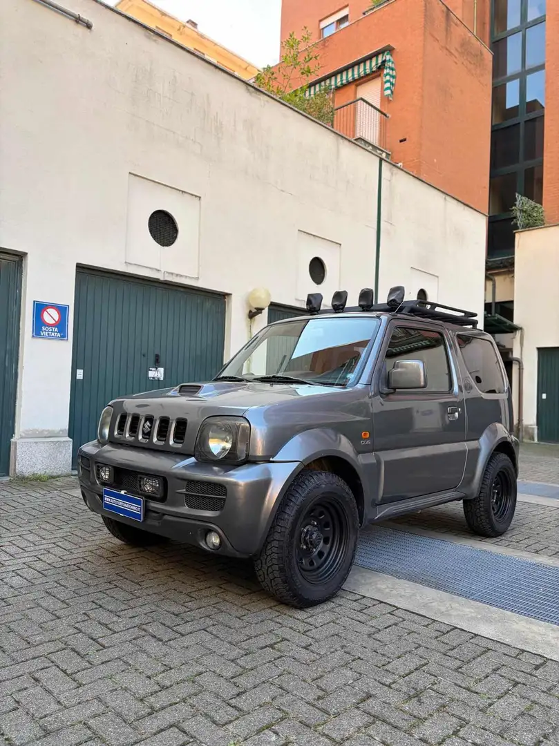 Suzuki Jimny 1.5 DDiS cat 4WD JLX Grijs - 1