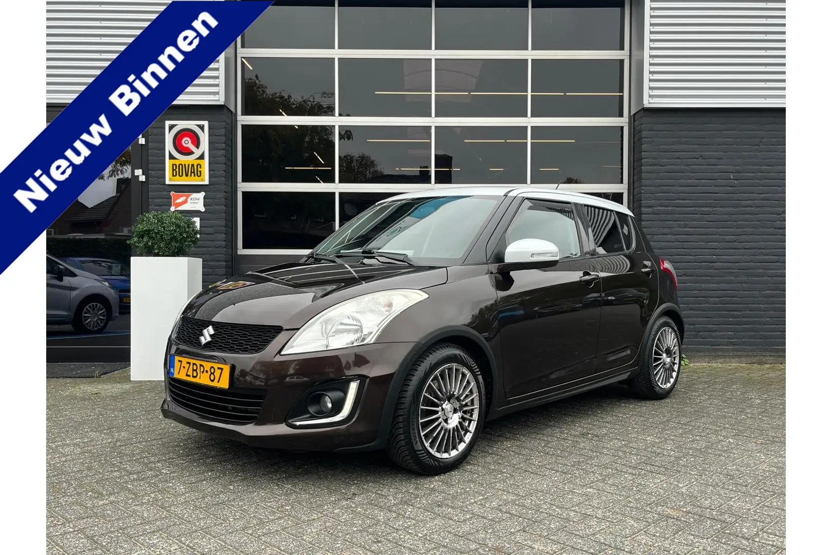 Suzuki Swift 1.2 Exclusive, Airco, Bluetooth, Cruise, Navi, Key Bruin - 1