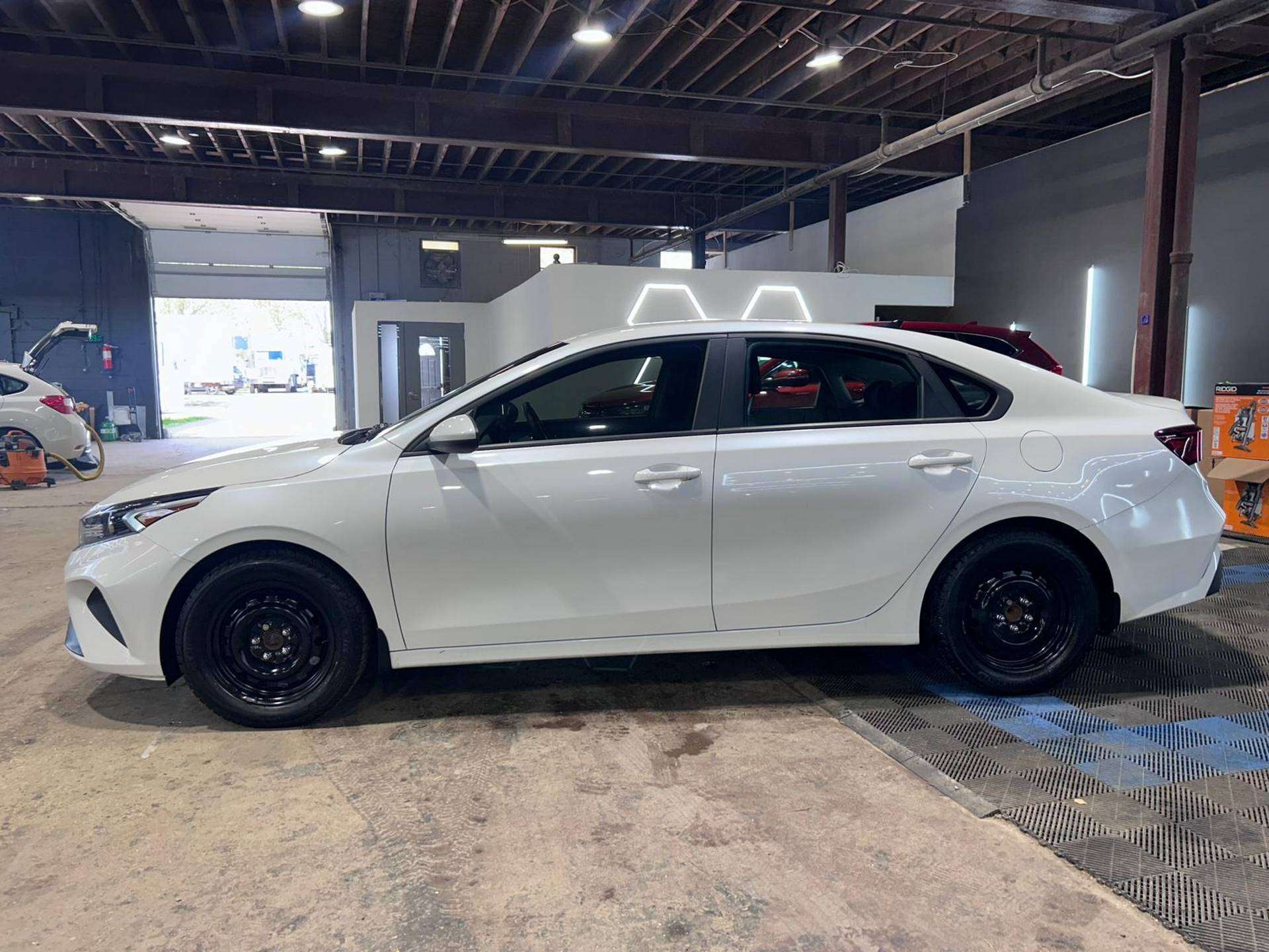White 2023 Kia Forte Sedan Front-Wheel Drive Automatic