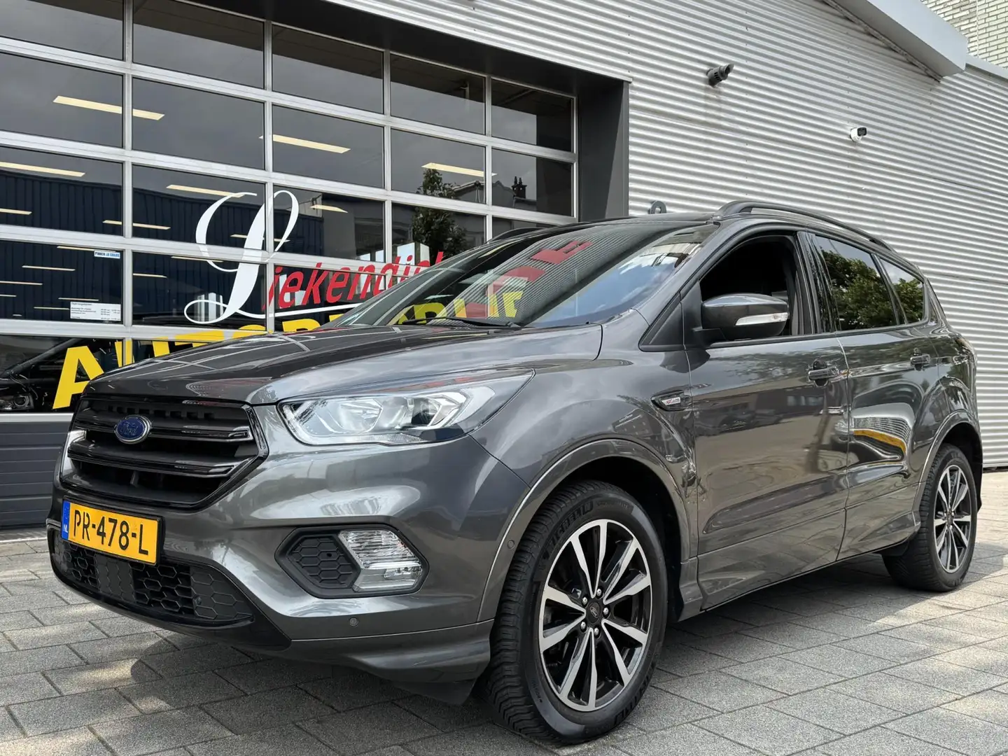 Ford Kuga 1.5 EcoBoost ST Line - Navigatie I Airco I Leer I Gris - 1