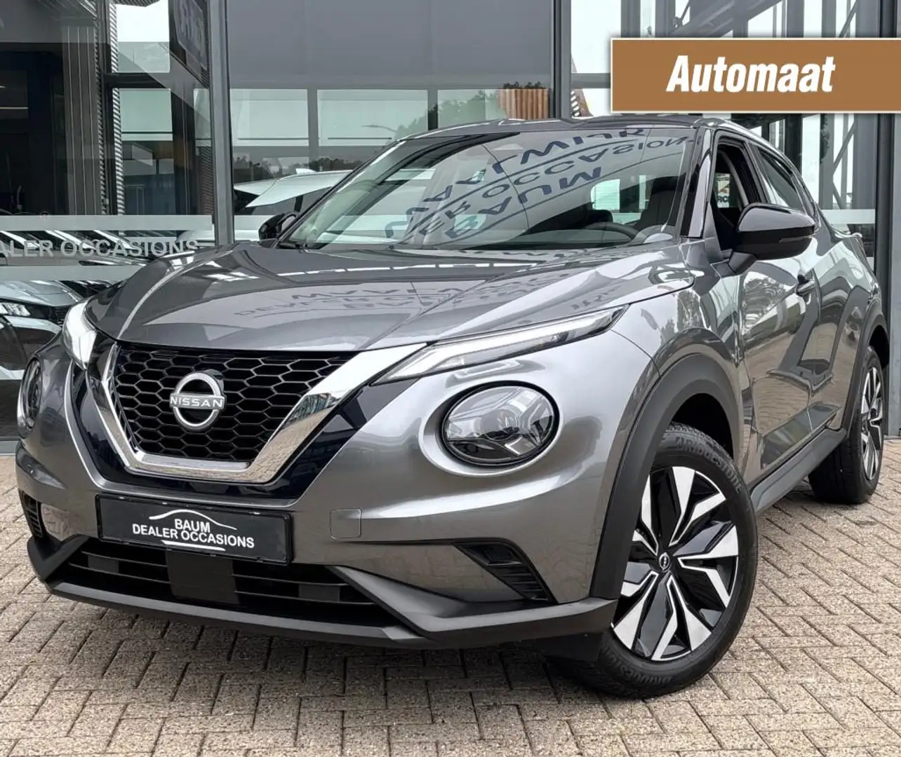 Nissan Juke 1.0 DIG-T ACENTA AUTOMAAT AIRCO NAVI PDC-CAMERA. Grijs - 1