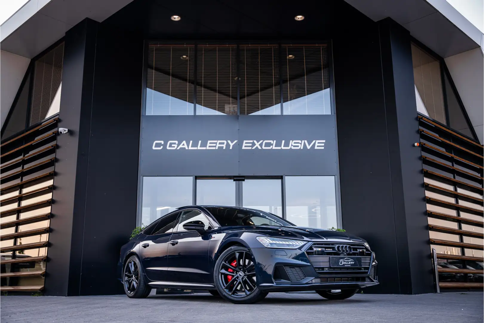 Audi A7 Sportback 55 TFSI e quattro Competition - Panorama Blauw - 1