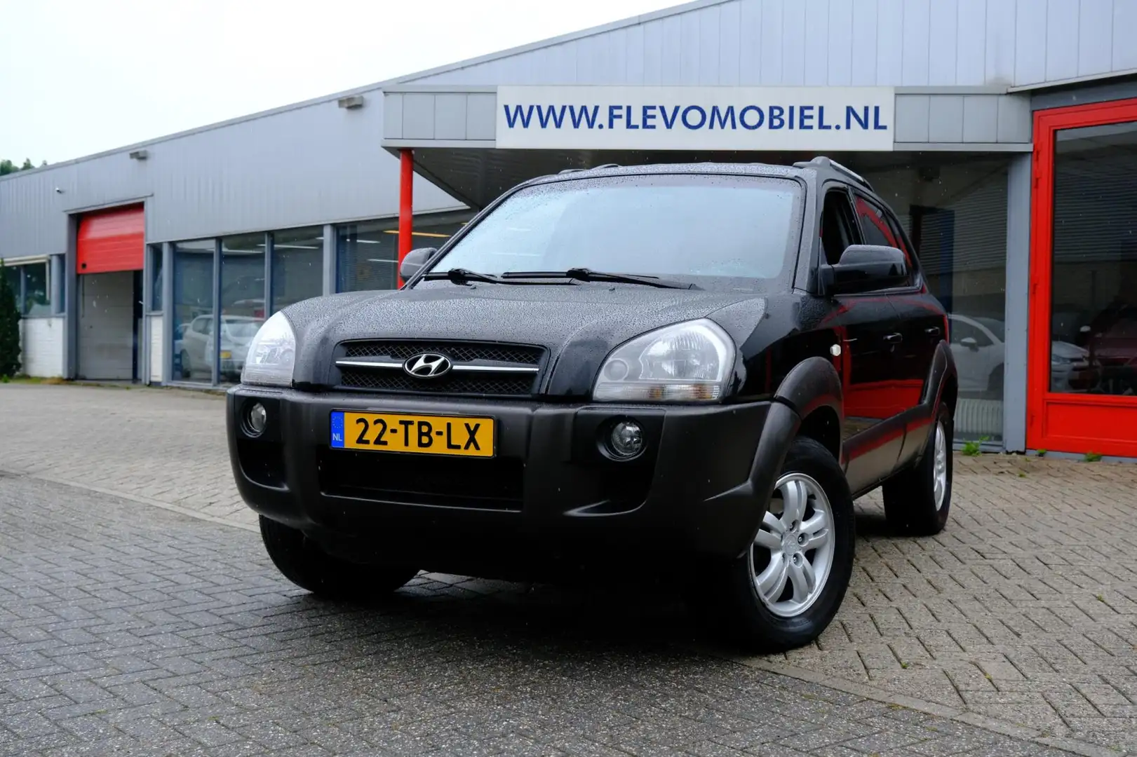 Hyundai TUCSON 2.0i Dynamic|Airco|LMV|Terkhaak Zwart - 1