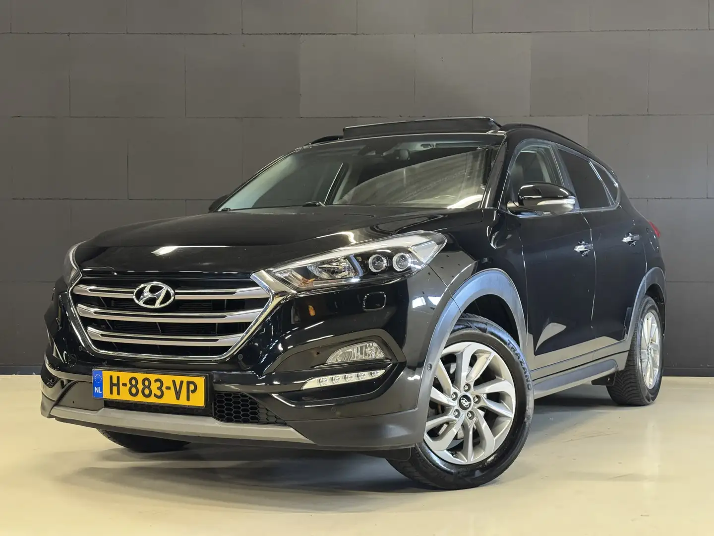 Hyundai TUCSON 1.6 T-GDi Premium 4WD 177PK Automaat | Panoramadak Zwart - 1