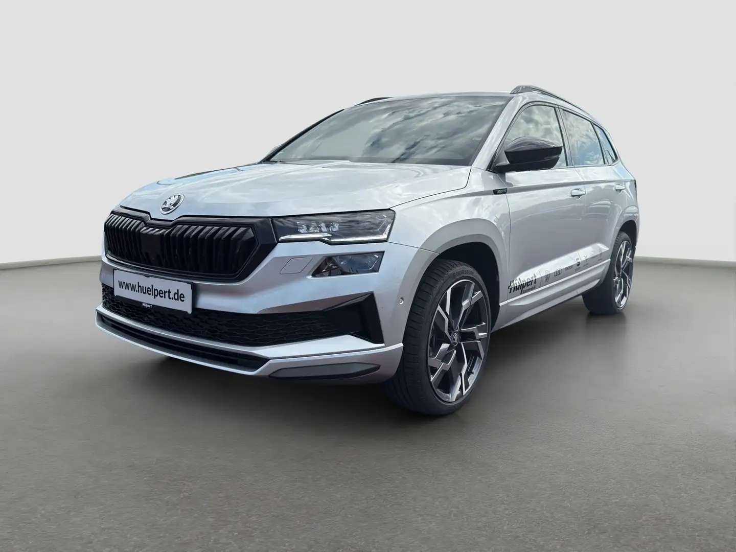 Skoda Karoq 2.0TDI DSG Sportline AHK NAV PANO ACC 360GRAD Silber - 2