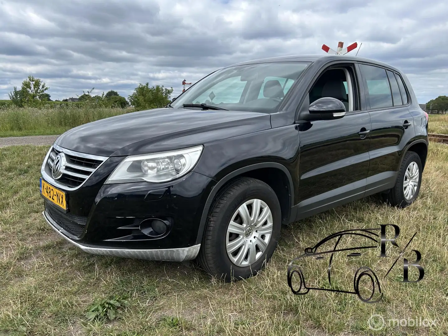 Volkswagen Tiguan 1.4 TSI Sport&Style AIRCO NAVI LEES TEKST Fekete - 1