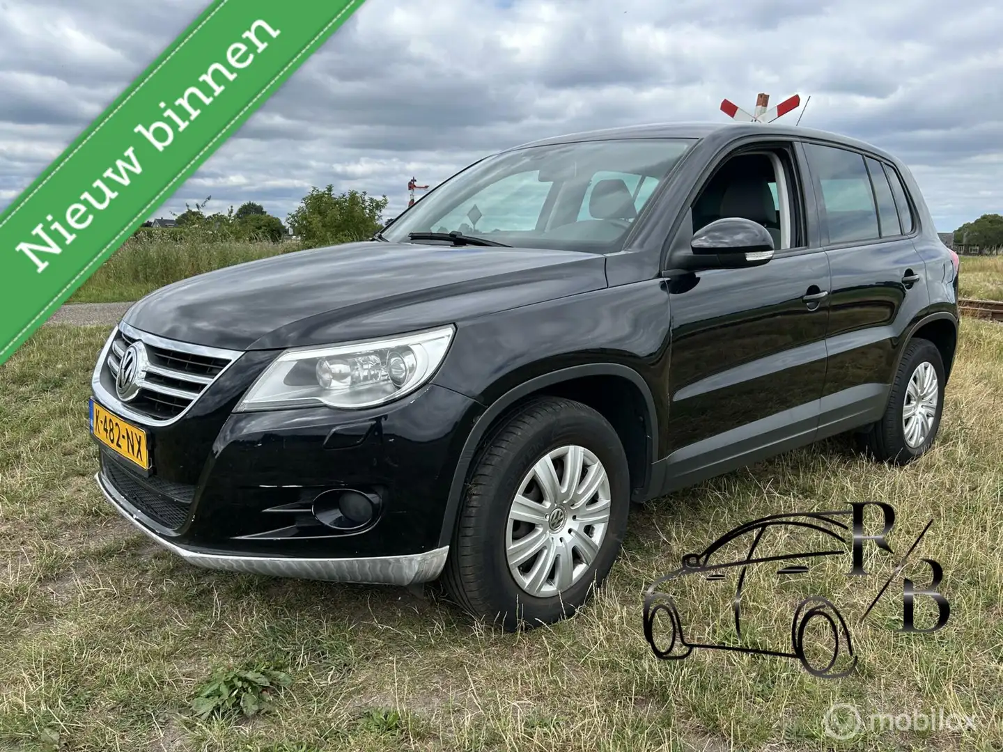 Volkswagen Tiguan 1.4 TSI Sport&Style AIRCO NAVI LEES TEKST Zwart - 1