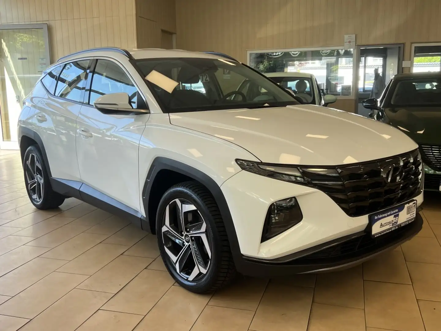 Hyundai TUCSON Plug-In*4WD*R.Cam*SHZ*DAB*digt.Cockpit Weiß - 1