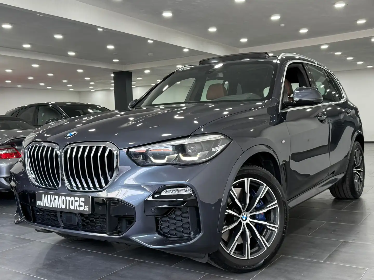 BMW X5 3.0dAS xDrive M-Pack Pano Individual BMW Service Grijs - 1