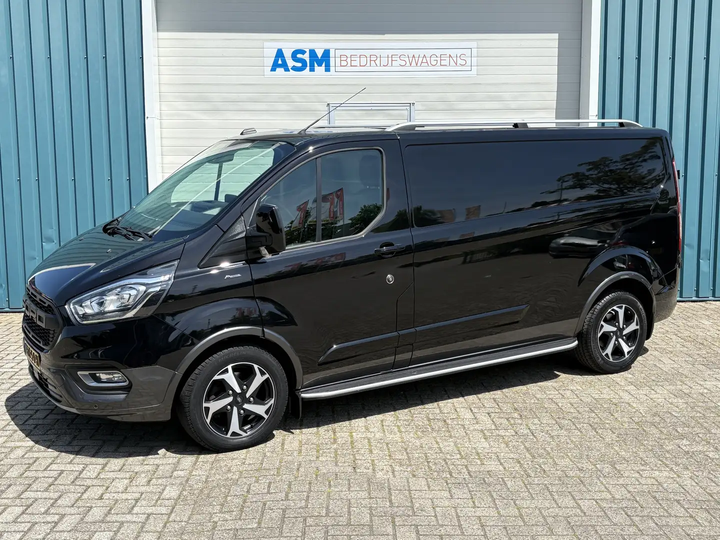Ford Transit Custom 300 2.0 130Pk TDCI L2H1 Limited / Cruise / Airco / Schwarz - 1