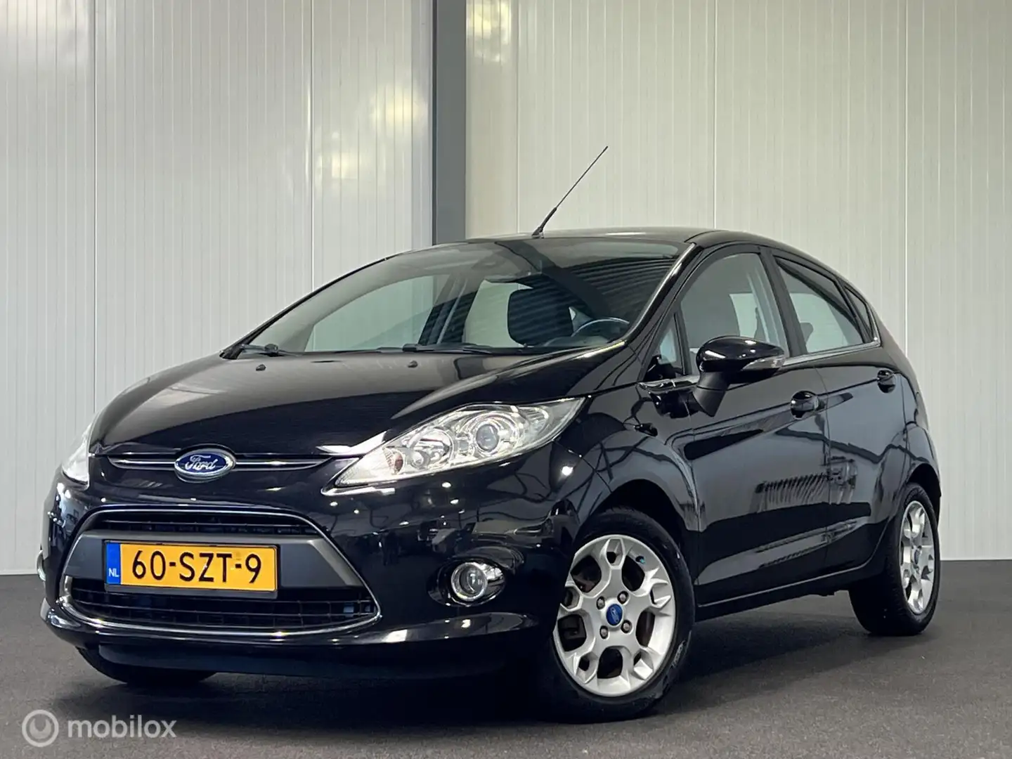 Ford Fiesta 1.25 Titanium 5-drs [ NAP 1e eig. cruise climate ] Negro - 1