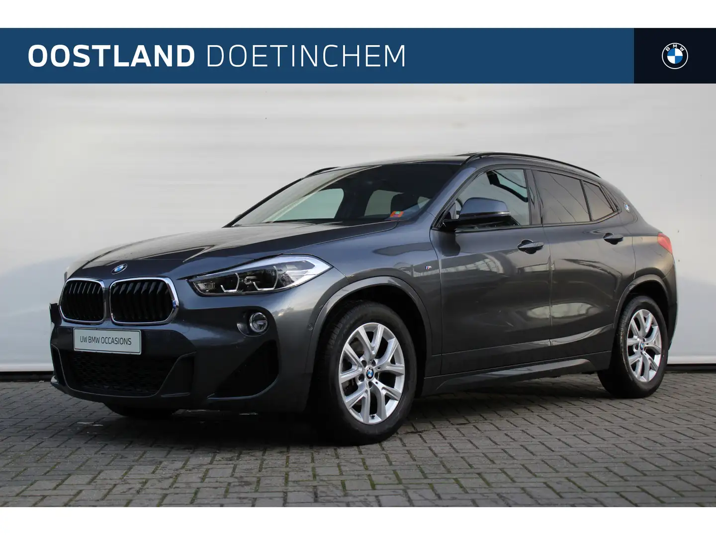 BMW X2 sDrive18i M Sport Automaat / Panoramadak / Trekhaa Grijs - 1