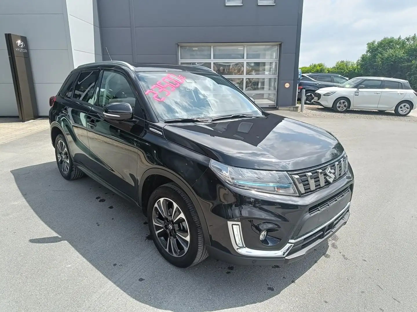 Suzuki Vitara HEV 1.5i GLX Sunroof (Site de Wavre 010/81.83.57) Noir - 1