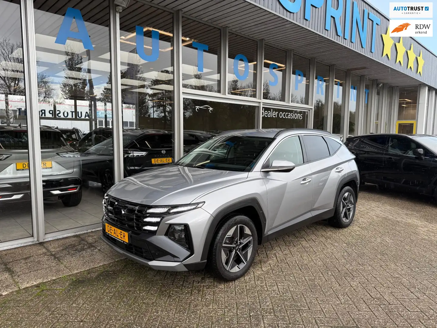 Hyundai TUCSON 1.6 T-GDI HEV Comfort 161PK / NAVIGATIE / ELEKTRIS Zilver - 1