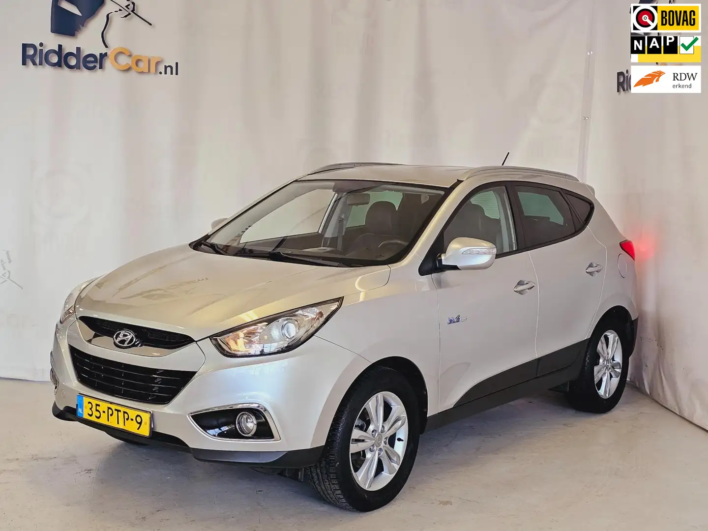 Hyundai iX35 1.6i GDI Style|NAP|CRUISE|PARK SENS|VELGEN|AIRCO|L Grijs - 1