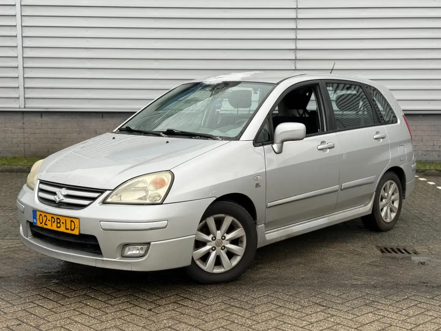 Suzuki Liana 1.6 Exclusive (INRUILKOOPJE) Grau - 1