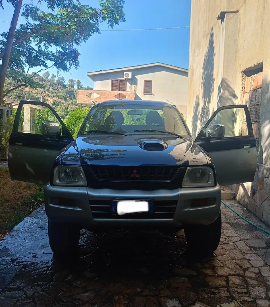 Mitsubishi L200 d.cab 2.5 tdi GLS Special Action 2 4wd - 1