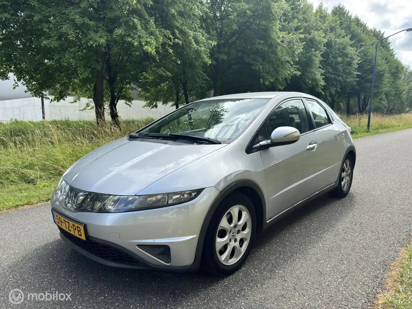Honda Civic 1.8 Comfort*AIRCO*6-BAK*ELEK. RAMEN*ONDERHOUD Grijs - 1