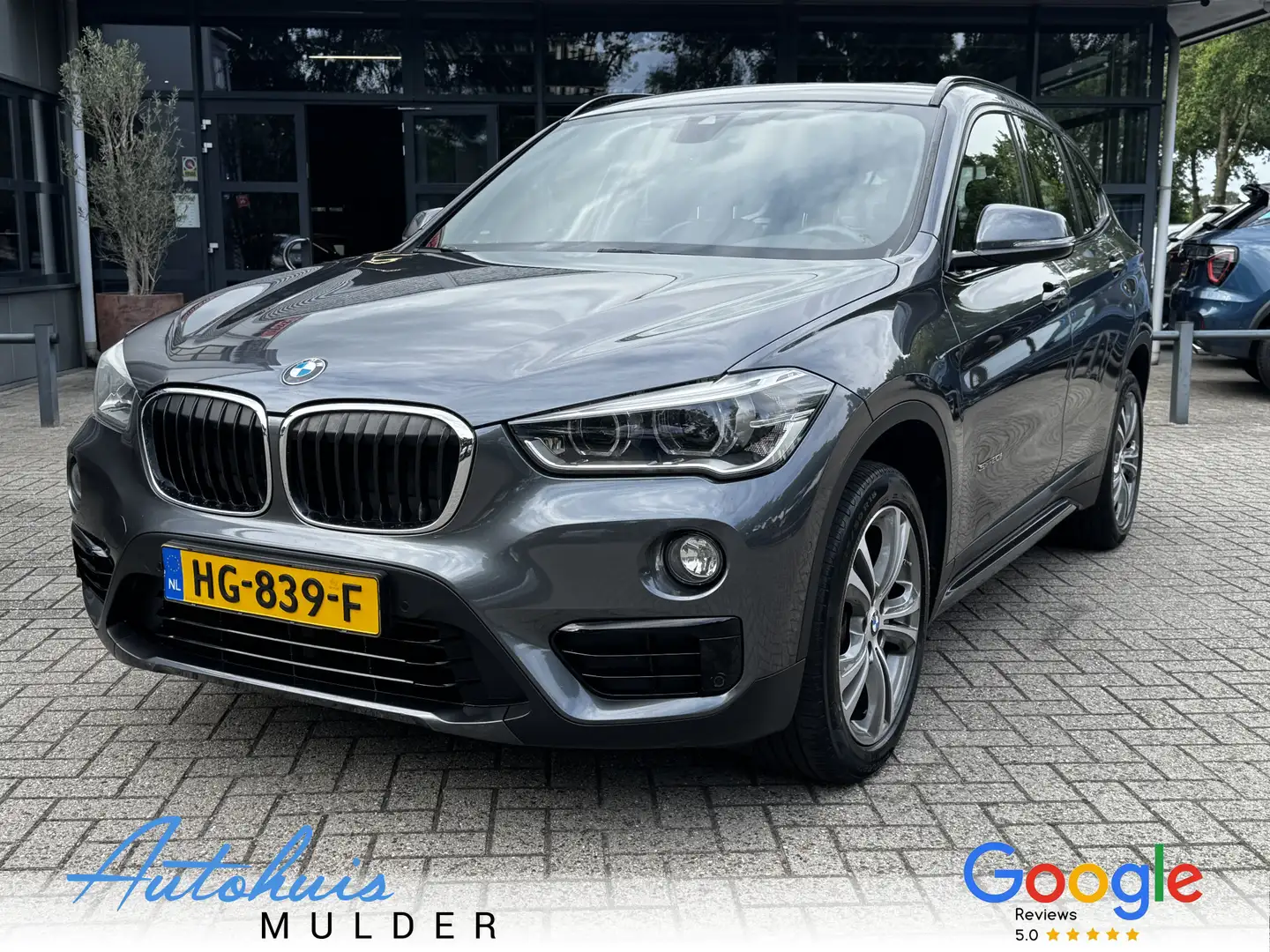 BMW X1 sDrive20i Automaat/Panoramadak/Cruise/Leder/Trekha Grijs - 1