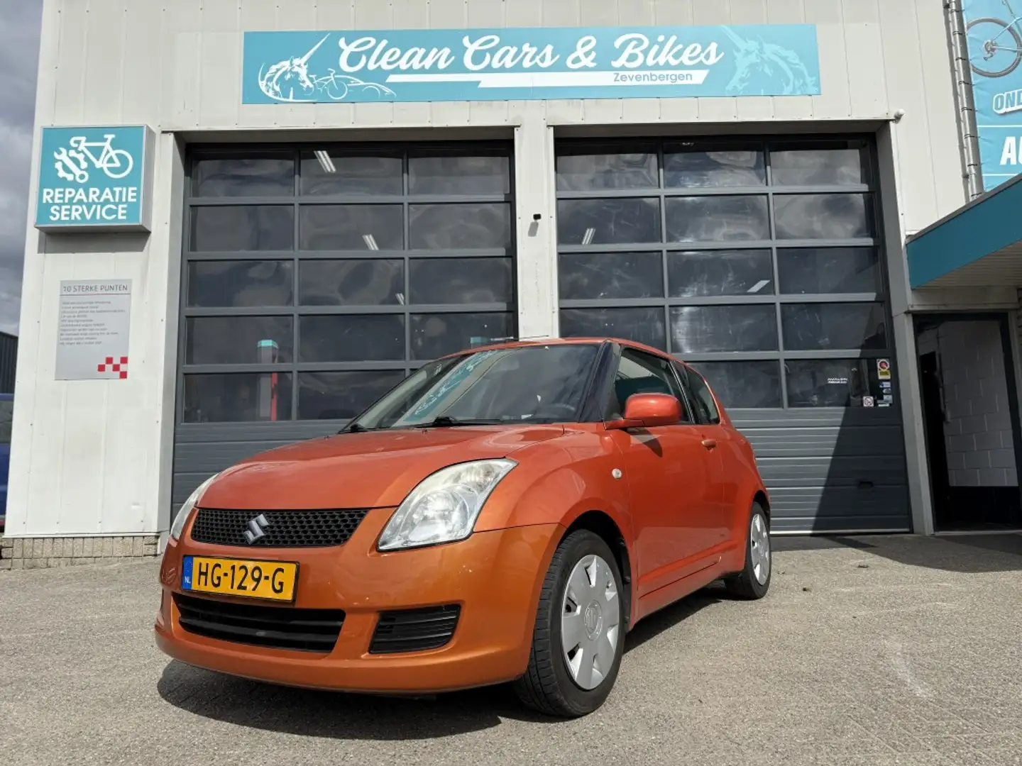 Suzuki Swift 1.3 GA Oranje - 1