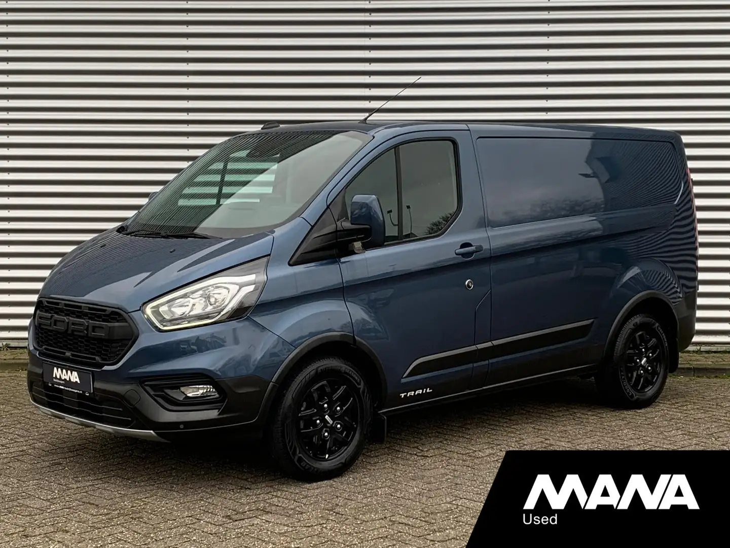 Ford Transit Custom 300 2.0 TDCI L1H1 Trail LED Airco Cruise Navi LMV Blauw - 1