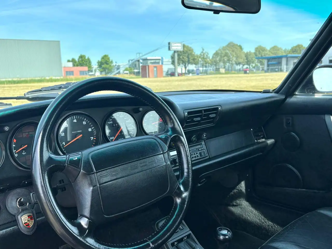 Porsche 964 Carrera 4 Coupé | Handgeschakeld | 2e Eig. | Zwart/Zwart | €15.000 Onderhoud recent, foto 7