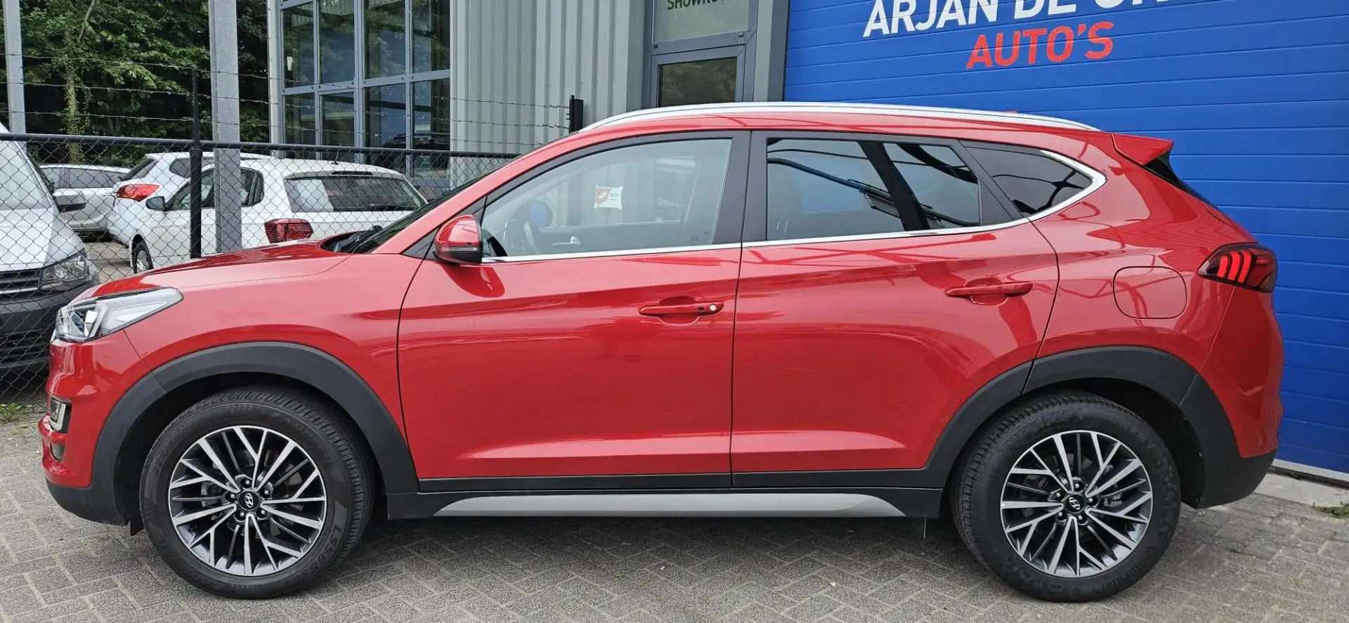 Hyundai TUCSON 1.6 T-GDI 177PK Navi Cruise Leder Carplay® Camera Rood - 2
