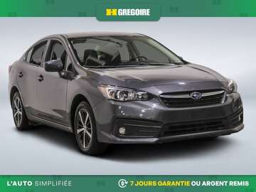 Touring  AWD MANUEL A/C GR ELECT MAGS CAM RECUL BL