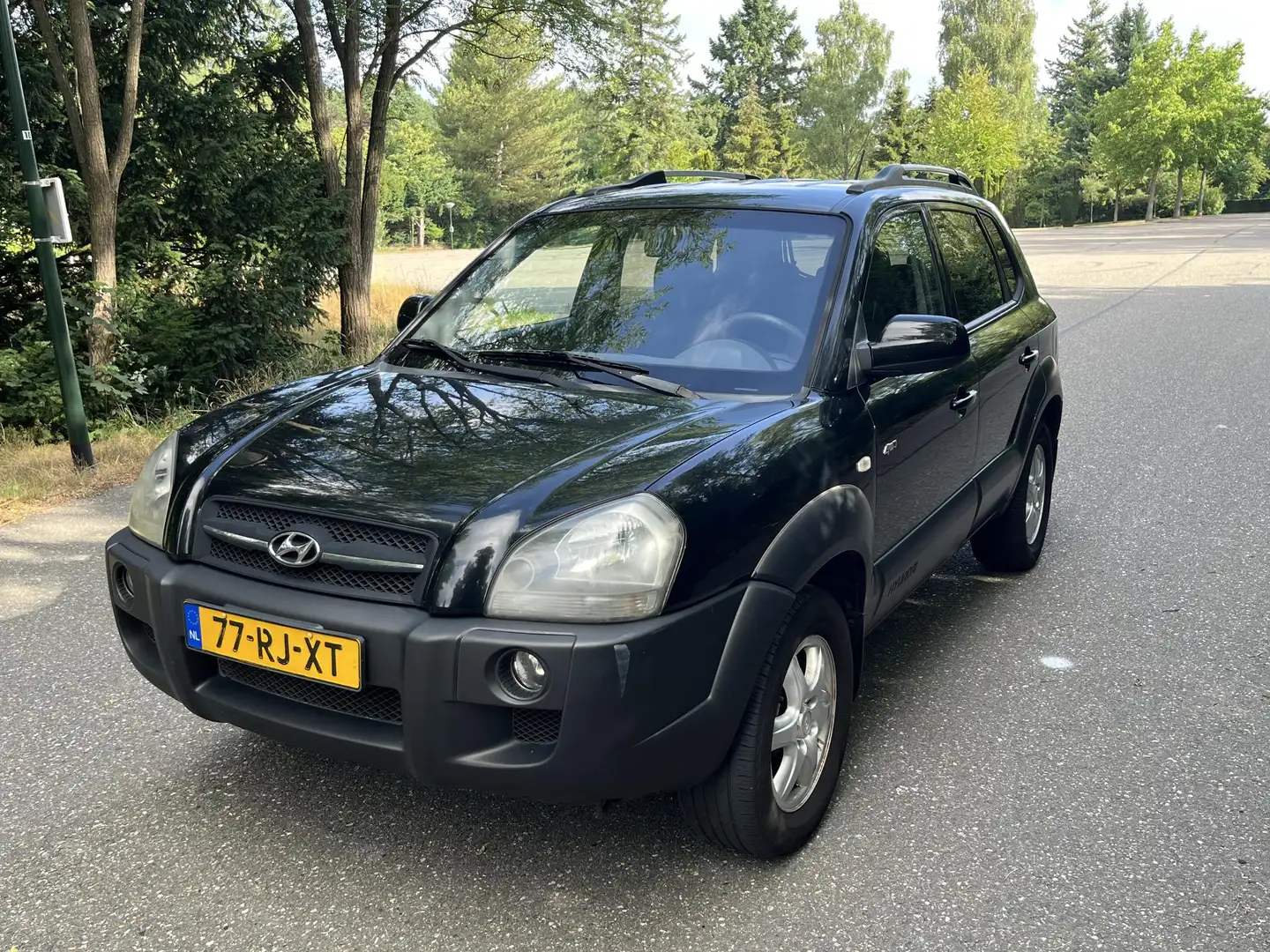 Hyundai TUCSON 2.7i V6 4WD Style G3 | Automaat | Airco | Trekhaak Zwart - 1