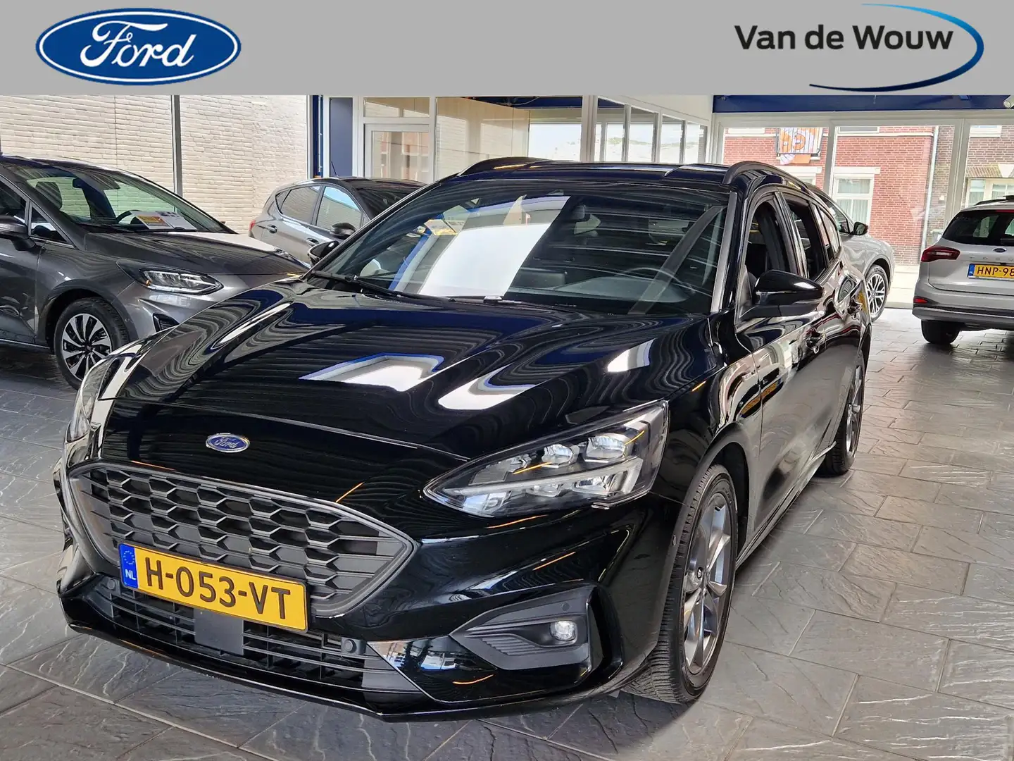 Ford Focus Wagon 1.0 EcoBoost ST Line Business Rode remklauwe Zwart - 1