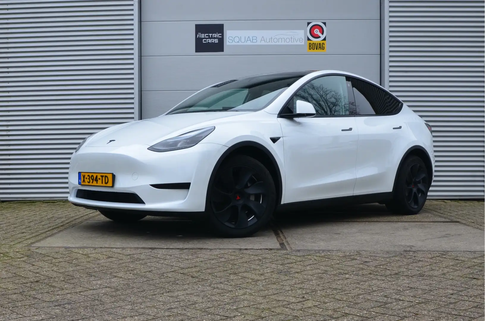 Tesla Model Y RWD 58 kWh LFP accu (100% opladen), AutoPilot Wit - 1