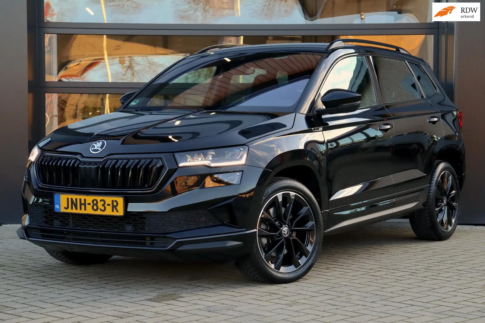 Skoda Karoq 1.5 TSI ACT Sportline Business DSG | Navigatie | M Schwarz - 1