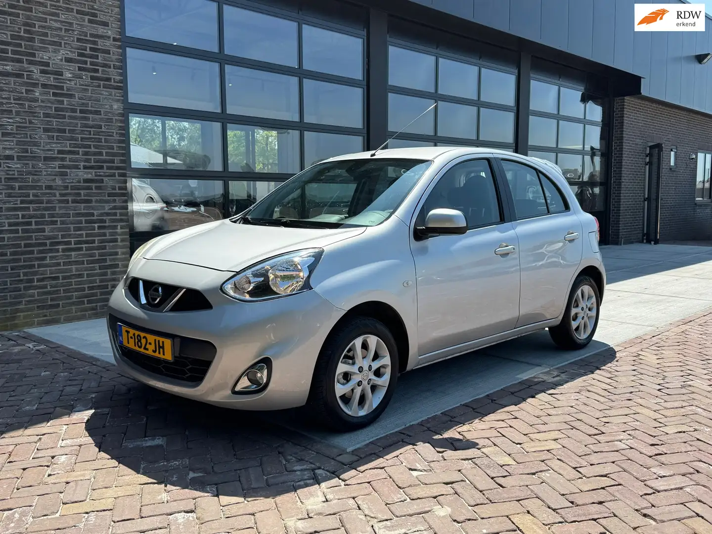 Nissan Micra 1.2 Tekna | 81.000KM! | Clima | Cruise | Stoel ver Grijs - 1