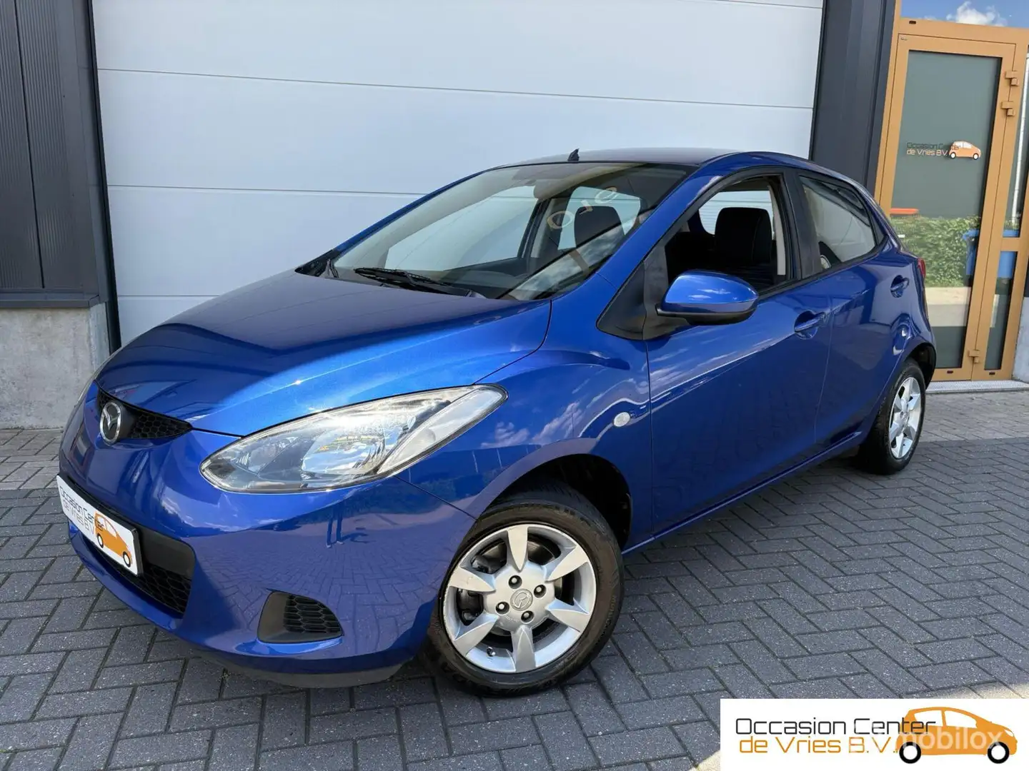 Mazda 2 1.3 5-deurs Airco Velgen Elektrisch Pakket Bluetoo Blauw - 1