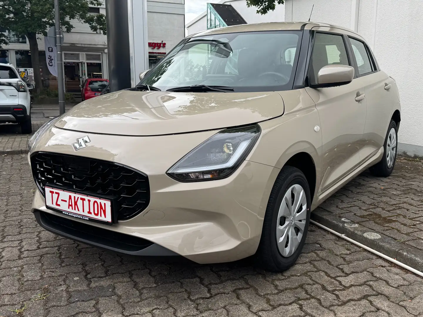 Suzuki Swift 1.2 Hybrid Allrad Club* Navi, Kamera, PDC* Beige - 1