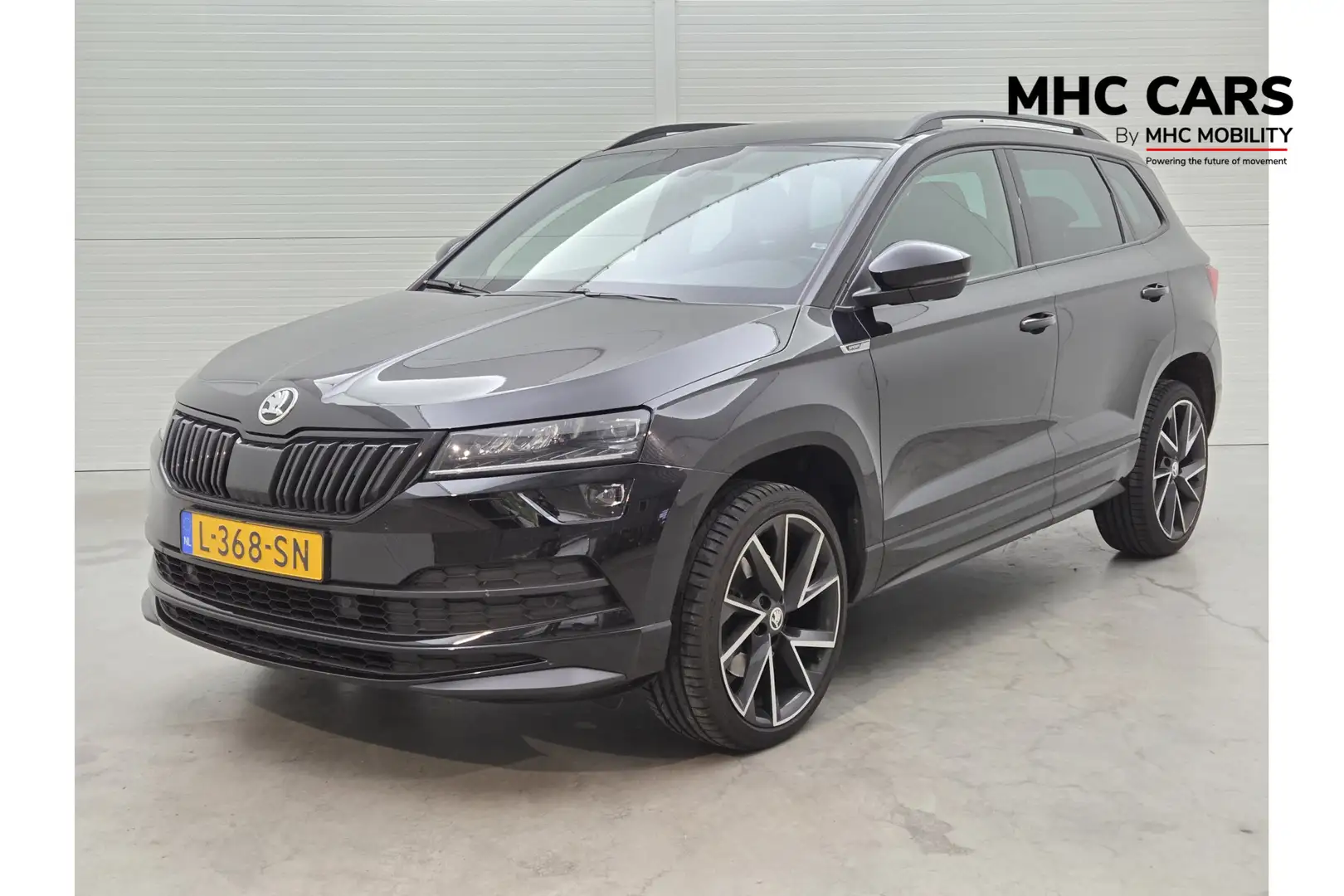 Skoda Karoq 1.5 TSI ACT Sportline Business | Functie pakket | Zwart - 1